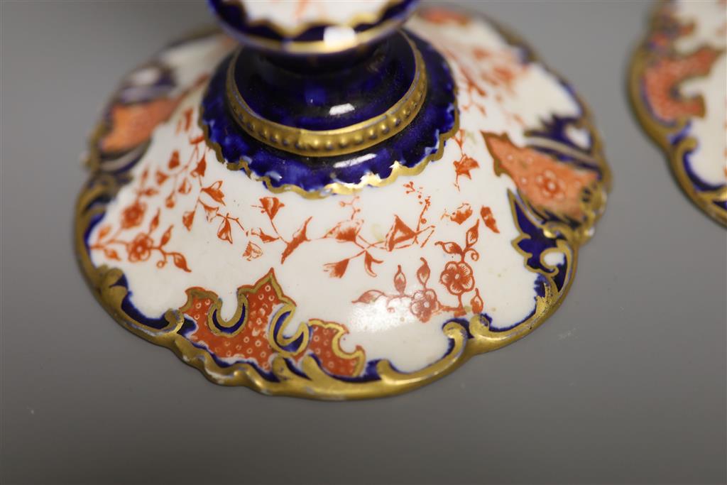 A pair of Royal Crown Derby candlesticks, height 15cm